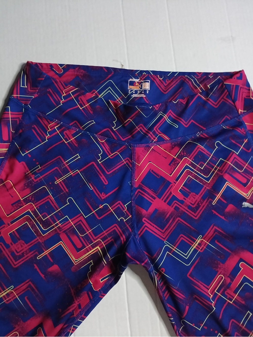 Puma women’s blue  & Pink Geometric Swim Rash Guard